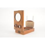 A 19th Century oak Graphoscope with beaded canted upper edges, 265mm long, G, with stereo cards -