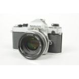 A Nikon FE SLR Camera, chrome, serial no 4014099, shutter working, meter responsive, timer