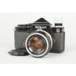 A Black Nikon F2 Eyelevel SLR Camera, serial no. 7 361 245, DE-1 prism, body F, brassing to some