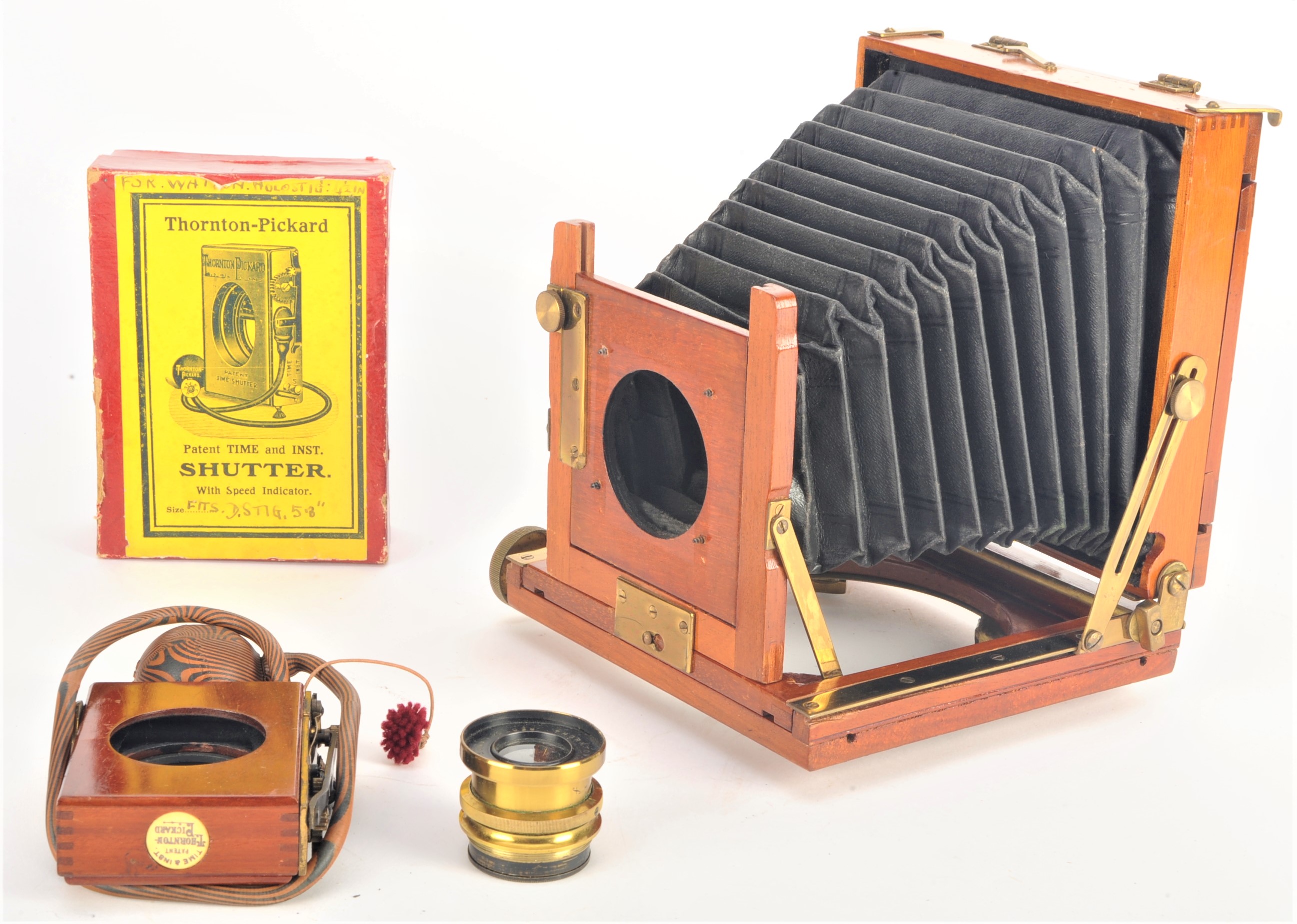 An early 20th Century mahogany and brass 3in x 4in Thornton-Pickard 'Tribune' Field Camera, with one
