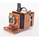 An early 20th Century mahogany and brass 3in x 4in Watson & Sons 'Alpha' Hand and Stand Camera, with