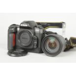 A Nikon D100 DSLR Camera, serial no. 2 189 277, body VG, powers up, shutter working, with an AF-S