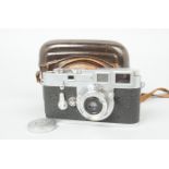A Leitz Wetzlar Leica M3 Double Stroke Camera, chrome, serial no. 749 305, 1955, early triangular