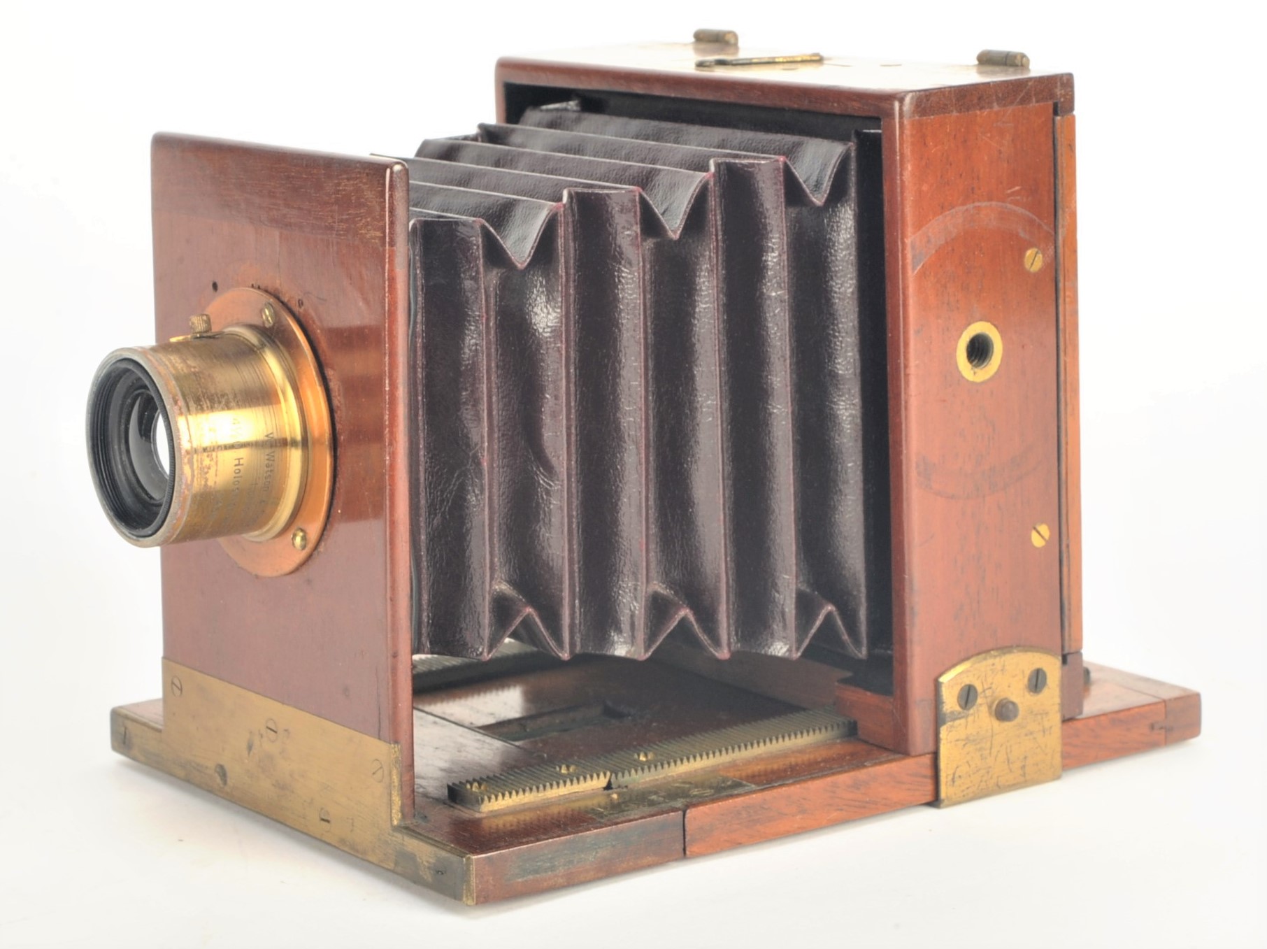 A 19th Century mahogany and brass quarter-plate Rouch Tailboard Field Camera, with inset maker's