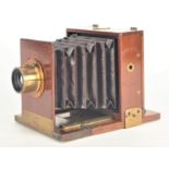 A 19th Century mahogany and brass quarter-plate Rouch Tailboard Field Camera, with inset maker's