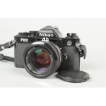 A Black Nikon FM2 SLR Camera, serial no. 7 148 238, body G, shutter working, meter reacts to