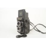 A Yashica Mat 124 G TLR Camera, serial no 231818, body G-VG, light marks, shutter working, meter