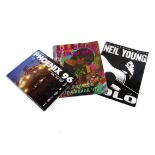 Neil Young Programmes, three programmes comprising In A Rusted Out Garage '87, An Evening With