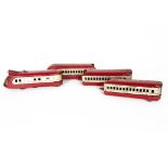 A Marx (British) 0 Gauge Electric M10000 Articulated Diesel Train, in lithographed red/silver with