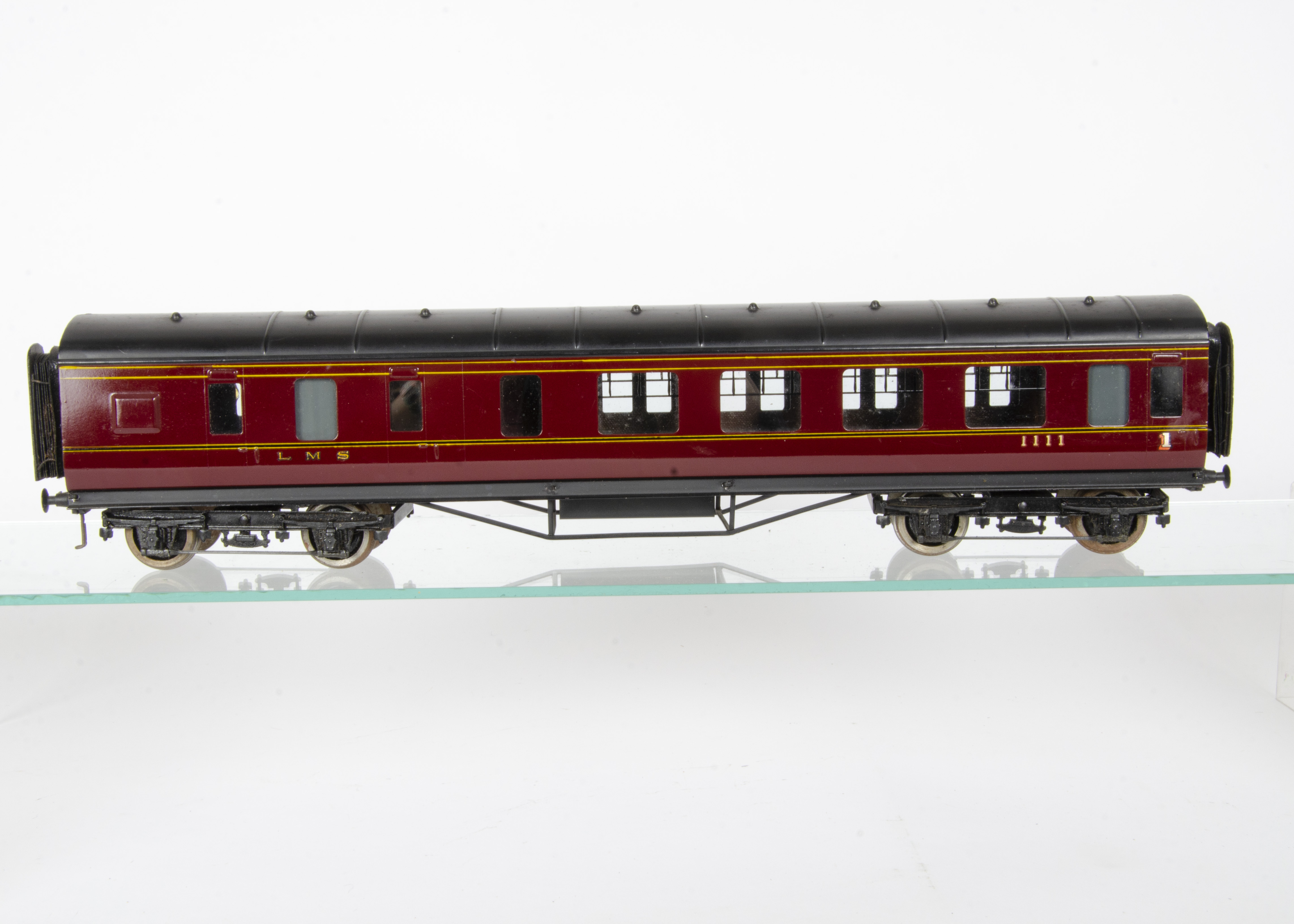 An Exley 0 Gauge LMS Main Line 57' Brake/1st Class Corridor Coach, in LMS crimson with transferred