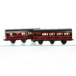 Two Exley 0 Gauge K6-type 6-wheeled LMS Coaches, in LMS crimson as 3rd Class no 200, with brake/