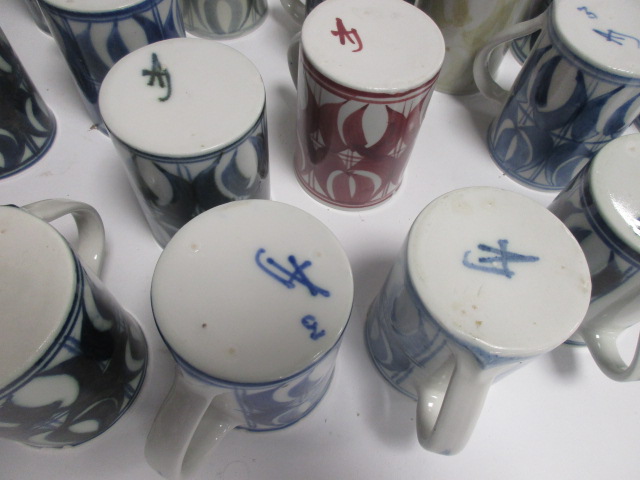 A collection of Aldermaston pottery cups, thirty two signed by Jenny Jowett and one by Alan Caiger- - Image 7 of 7