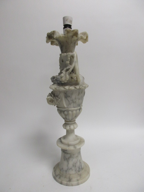 A 20th Century marble lamp base, modelled as a twin-handled urn with fluted edges upon a circular - Image 2 of 4