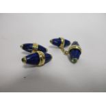 A pair of lapis and emerald cufflinks, with emeralds to each end