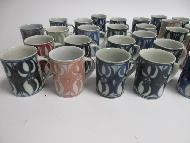 A collection of Aldermaston pottery cups, thirty two signed by Jenny Jowett and one by Alan Caiger- - Image 3 of 7