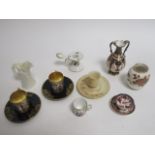 A group of miniature porcelain to include a pair of Vienna cups and saucers with gilt heightening,