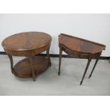 A contemporary mahogany and walnut two tier oval centre table, inlaid fan design to top and lower