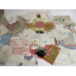 A collection of 1940s & 1950s textiles, including a velvet pyjama case, hand embroidered