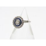 A contemporary Edwardian style sapphire and diamond target ring, the central old cut diamond, 0.