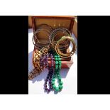 A quantity of costume jewellery, including various beads in amethyst and malachite, one with Chinese
