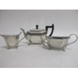 An Art Deco silver plated three piece tea set, consisting of teapot, sugar bowl and milk jug, marked