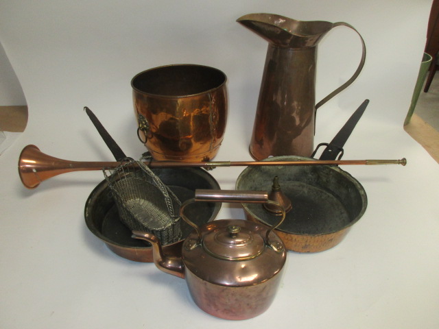 A small group of mostly copper wares, to include a tall jug, height 41cm, warming pan, kettle and