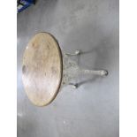 A 19th Century Biclam circular cast iron pub table, mahogany top, the pierced base having an under