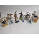 A group of predominantly British Victorian Staffordshire figures, to include 'Returning Home' height