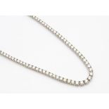 A contemporary 18ct white gold graduated diamond 'Riviere' line necklace, the brilliant cut diamonds