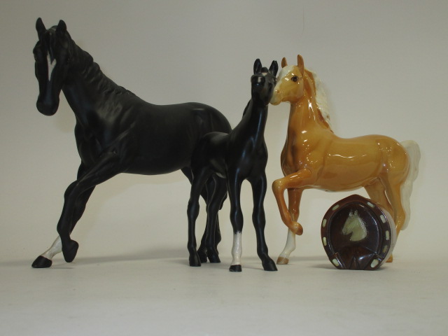 A Royal Doulton figure of a horse, together with two Beswick examples and a novelty pin pot , the