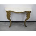 A 19th Century Rococo style continental serpentine gilded console table, shaped marble top with
