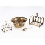 Four items of early 20th Century silver, including a toast rack, a letter rack, a bowl and a small