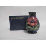 A contemporary Moorcroft pottery vase, of footed baluster form, in the 'Anemone' pattern, with