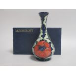 A contemporary Moorcroft vase, of baluster form, in the 'Poppy' pattern designed by by Rachel