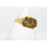 An 18ct yellow gold gentleman's signet ring bearing an ornate family coat of arms, with the Latin