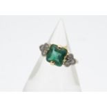 An 18ct yellow gold emerald and diamond dress ring, the cushion cut emerald in claw setting (a/f)