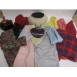 A collection of novelty clothing, including two metallic jackets, a pair of tartan trousers, five