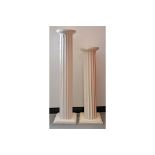 Two 20th Century hardwood plinths, modelled as Roman columns with square bases, painted white,