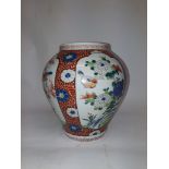 Nineteenth Century Chinese Vase, of ovoid form with floral red decoration surrounding four panels