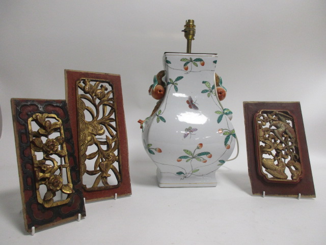 A contemporary Asian lamp base, decorated with butterflies and foliage upon a white ground, the
