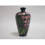 A contemporary Moorcroft pottery vase, of baluster form, a trial piece in the 'Wisteria' pattern