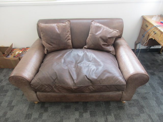 A contemporary brown Jasper Conran distressed two seater leather sofa, 148cm x 108cm x 75cm