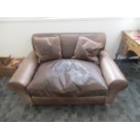 A contemporary brown Jasper Conran distressed two seater leather sofa, 148cm x 108cm x 75cm