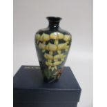 A contemporary Moorcroft pottery vase, of tapering shoulder form, with tube lined decoration of