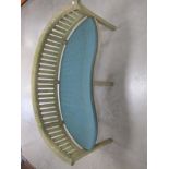 A contemporary hardwood curved back garden bench, with a green loose cushion, 160cm x 60cm x 84cm