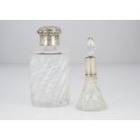 Two late 19th Century glass and silver mounted scent bottles, one with spiral base, cloudy, with