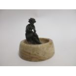 An early 20th Century bronze study of a mythical piper, raised upon an ash tray, height 13cm