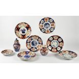 A small collection of Imari ware, to include a pair of dishes with central flying bird design,