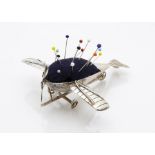 A rare early 20th Century silver novelty aeroplane pin cushion by B & S Ltd, marked Birmingham 1912,