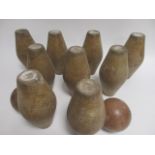 A set of nine early 20th Century turned wooden skittles, together with two balls (11)